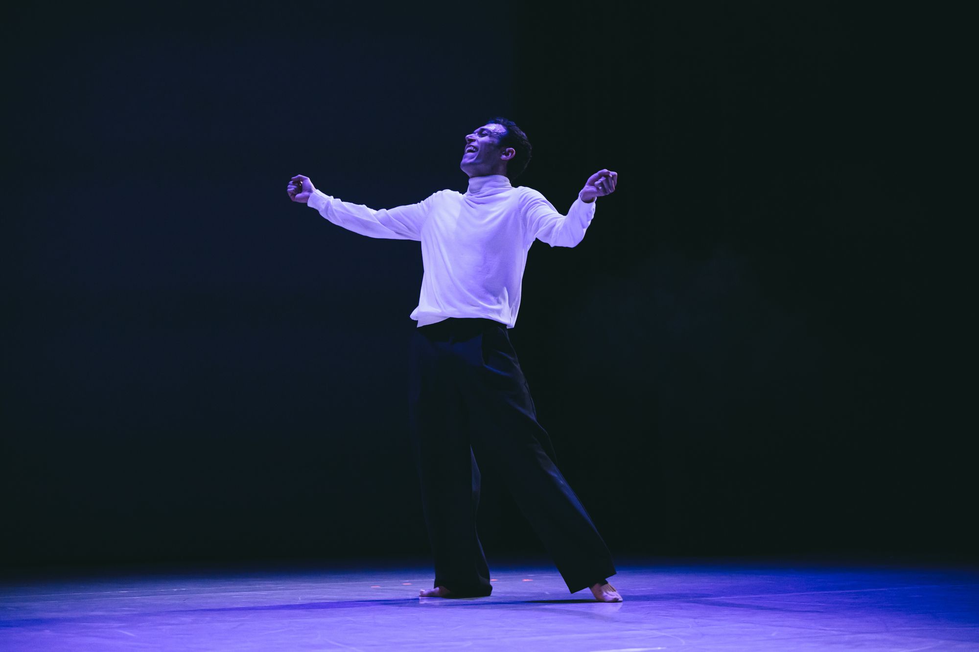 Alexandros with arms open in a wide stance